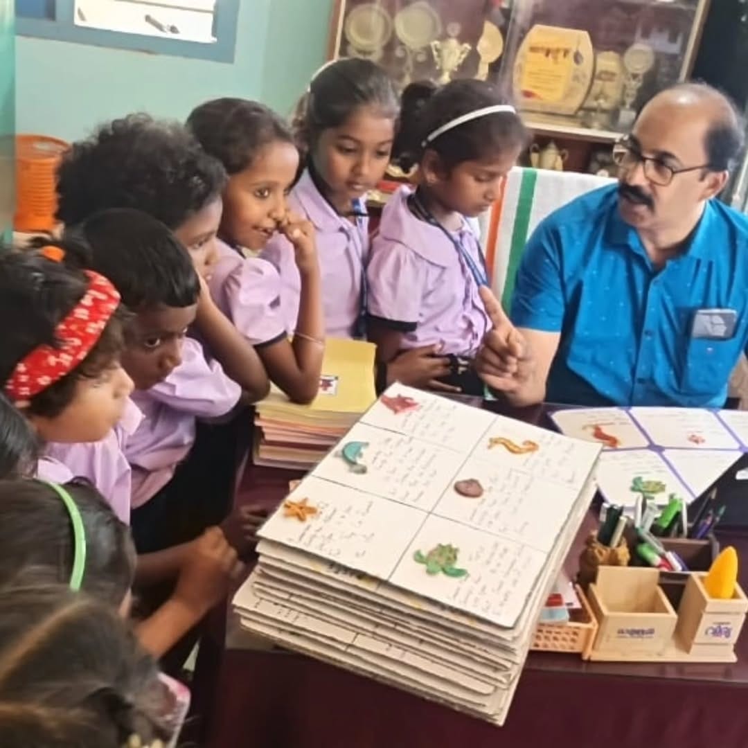 2 volunteers donated ocean-themed clay models created by EY employees to support marine-life learning for 50 students at Govt. High School, Pulikkamali, Kochi.