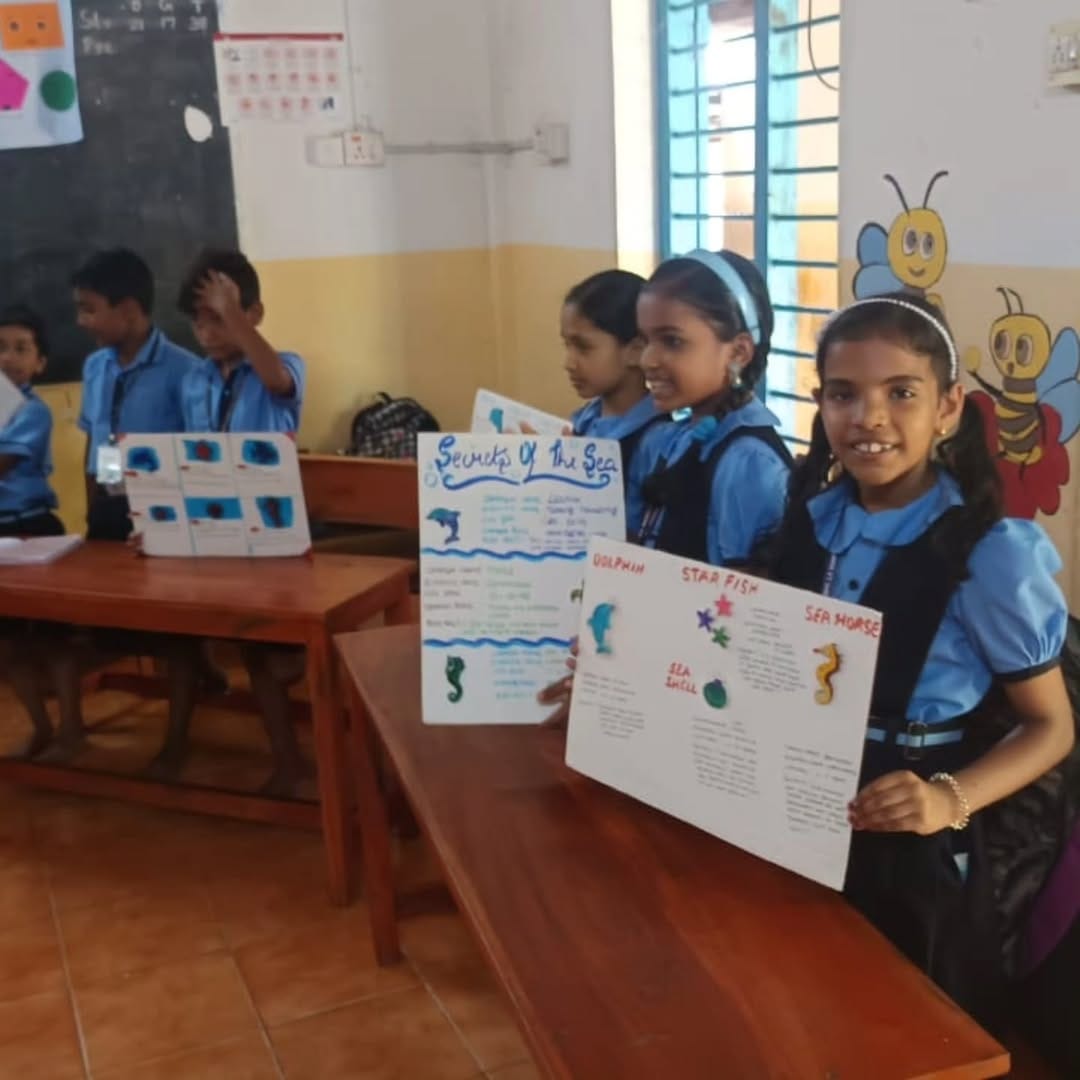 2 volunteers donated ocean-themed clay models created by EY employees to support marine-life learning for 50 students at MAAM LP School, Kakkanad, Kochi.